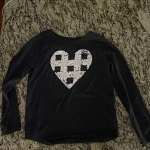 This long sleeve tee made out of cotton the hart changes  color of plaid